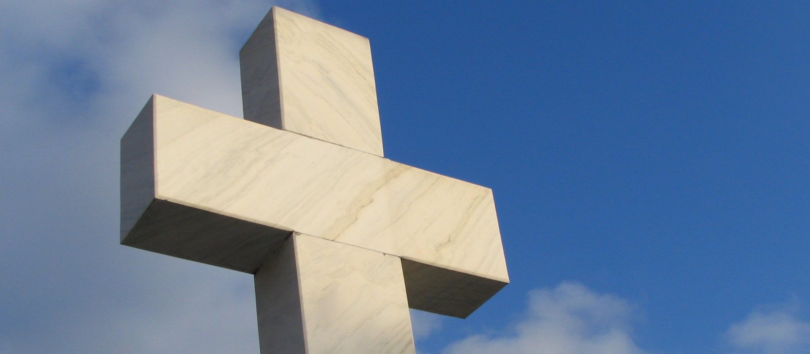 A large cross monument outside.