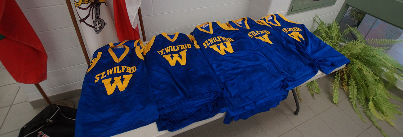 School's athletic shirts on a table